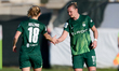 Alexandra Popp of VfL Wolfsburg receives congratulations from teammate Justine Kielland af...