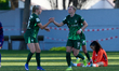 Alexandra Popp of VfL Wolfsburg receives congratulations from teammate Ella Peddemors afte...
