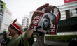  Campaign leaflets being distributed during the Upper House election campaign outside of I...