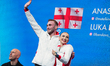 Anastasiia Metelkina and Luka Berulava of Georgia react in the Pairs Free Skating during t...