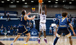 Cornelius Robinson III, 23, of the Monmouth Hawks attempts a three-point field goal during...