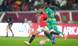 Mohamed Salah Mahrous Ghaly of Egypt and Nicolas Jackson of Senegal battle for the ball  d...