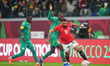 Mohamed Salah Mahrous Ghaly of Egypt and Nicolas Jackson of Senegal battle for the ball  d...