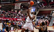 Justice Ajogbor, 22, of the St. Joseph's Hawks goes for a rebound during an NCAA men's bas...