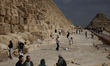 People are seen at the pyramid complex in Giza, Egypt on January 14, 2026. 