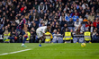 Vinicius Junior of Real Madrid is in action with the ball, defended by Jeremy Toljan of Le...