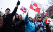 Protesters wave Greenland flags during a demonstration under the slogans 'hands off Greenl...