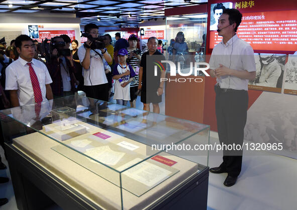 People visit an exhibition at the Museum of the War of Chinese People's Resistance Against Japanese Aggression in Beijing, capital of China,...