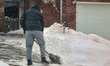 A man shovels snow during the winter season in Toronto, Ontario, Canada, on January 17, 20...