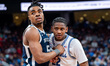 MICHAEL AJAYI (5) of the Butler Bulldogs and ELIJAH FISHER (22) of the Seton Hall Pirates...