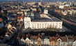 An aerial drone view centers on the Pomeranian Dukes' Castle complex surrounded by the Old...