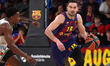 Tomas Satoransky and McKinley Wright IV play during the match between FC Barcelona and Dub...