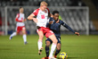 Amario Cozier Duberry of Bolton Wanderers is challenged by Lewis Freestone of Stevenage du...