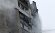 A 16-storey residential building is engulfed in smoke after a Russian drone attack in Dnip...