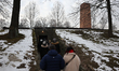 A view of the crematory as visitors are seen at the former Nazi German concentration camp...