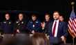 U.S. Vice President JD Vance gives a press conference while standing in front of ICE agent...