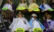 Shopkeepers in Mexico City, Mexico, on January 22, 2026, sell figurines of the Christ Chil...