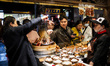 In Chengdu, China, on April 12, 2025, in the lively Kuanzhai Xiangzi district, street food...