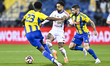 Mathias Antonsen Normann of Al-Gharafa and Caio Lucas of Sharjah are in action during the...
