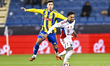 Fabricio Diaz Badaracco of Al-Gharafa and Caio Lucas of Sharjah are in action during the S...