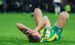 Krystian Bielik of West Bromwich Albion is on the ground injured, waiting for treatment du...