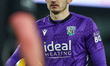 Max O'Leary of West Bromwich Albion waits with the ball for the referee to restart play du...