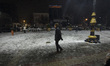 An Iranian man walks along a snow-covered area in downtown Tehran, Iran, on January 23, 20...