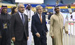 Former IOC President Thomas Bach (C) walks with Qatari officials during a visit to the Epe...