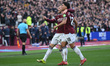 Jarrod Bowen of West Ham United celebrates with Mateus Fernandes of West Ham United after...