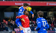 Tom Lockyer of Bristol Rovers beats Daniel Udoh of Salford City FC to the ball during the...
