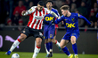 PSV Eindhoven midfielder Ismael Saibari and NAC Breda midfielder Max Balard play during th...