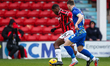 Daniel Kanu of Walsall FC is chased by Donald Love of Accrington Stanley during the Sky Be...