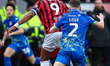 Jamille Matt of Walsall FC and Donald Love of Accrington Stanley battle for possession dur...