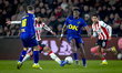 PSV Eindhoven midfielder Ismael Saibari and NAC Breda defender Cherrion Valerius play duri...