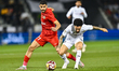 Claudio Luiz Rodrigues of Al Sadd FC and Sultan Adil Alameeri of Shabab Al Ahli Dubai FC a...