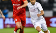 Paulo Otavio Rosa of Al Sadd FC and Saeid Ezatolahi of Shabab Al Ahli Dubai FC are seen in...