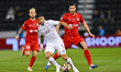 Paulo Otavio Rosa of Al Sadd FC and Saeid Ezatolahi of Shabab Al Ahli Dubai FC are seen in...