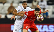 Pedro Miguel of Al Sadd FC and Sultan Adil Alameeri of Shabab Al Ahli Dubai FC are seen in...