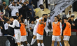 Players of Al Sadd SC celebrate after winning the Qatar-UAE Super Shield final between Qat...