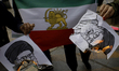 Iranians in Mexico City, Mexico, on January 24, 2026, burn a portrait of Ali Khamenei, Ira...