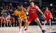KEVON VANDERHORST (3) of the Drexel Dragons drives the ball against HARIS ELEZOVIC (22) of...