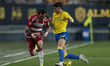 In Cadiz, Spain, on January 24, 2026, Alex Sola of Granada CF competes for the ball with I...