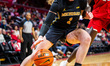Olivia Olson of the Michigan Wolverines drives the ball during an NCAA women's basketball...