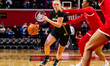 Olivia Olson of the Michigan Wolverines drives the ball during an NCAA women's basketball...