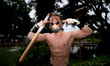 A cosplayer dressed as the character Borderlands Psycho poses for a photo during a cosplay...