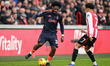 Ola Aina of Nottingham Forest is under pressure from Kevin Schade of Brentford during the...