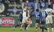 Adrian Benedyczak of Parma AC competes for the ball with Honest Ahanor of Atalanta BC duri...