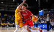 Xavier Abreu of the Northeastern Huskies drives the ball during an NCAA men's basketball g...
