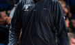 Bill Coen, the head coach of the Northeastern Huskies, is present during an NCAA men's bas...