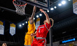Xavier Abreu of the Northeastern Huskies goes up for a layup during an NCAA men's basketba...